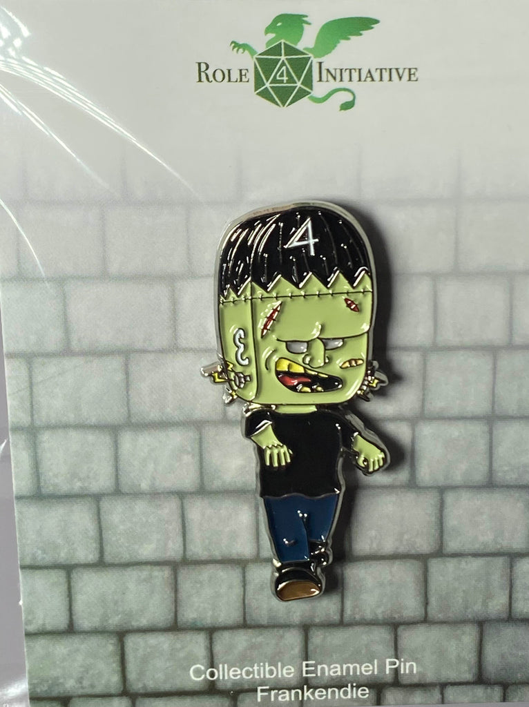 A soft enamel pin depicting a Frankenstein-esque monster created with an Arch'd4 for a head. Cue the rolling in their grave jokes!