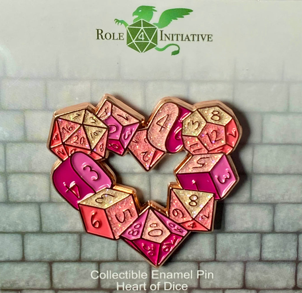 A soft enamel pin depicting a heart of dice, signifying the love you may have for someone, a special game, or just yourself.